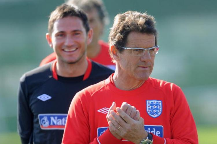 Frank Lampard smiles as England manager Fabio Capello looks on during the England training session at the Royal Bafokeng Sports Campus on June 21, 2010 in Rustenburg, South Africa. (Photo by Michael Regan/Getty Images) Frank Lampard smiles as England manager Fabio Capello looks on during the England training session at the Royal Bafokeng Sports Campus on June 21, 2010 in Rustenburg, South Africa. (Photo by Michael Regan/Getty Images)