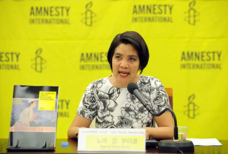 Amnesty researcher Norma Kang Muico speaks at a press conference on North Korea's health care in Seoul on July 15. North Korea has is in a very desperate state of a health care system, Amnesty International said. (Jung Yeon-je/Getty Images)