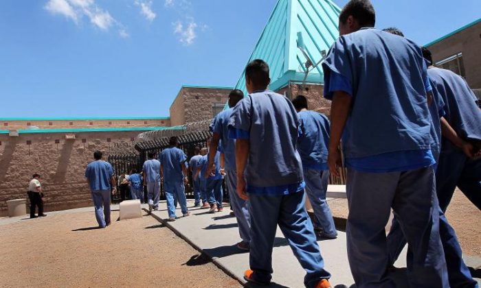 Detained immigrants locomotion  backmost  to their lodging  units pursuing  luncheon  astatine  the U.S. Immigration and Customs Enforcement (ICE) detention installation  connected  July 30, successful  Florence, Arizona.  ( John Moore/Getty Images)