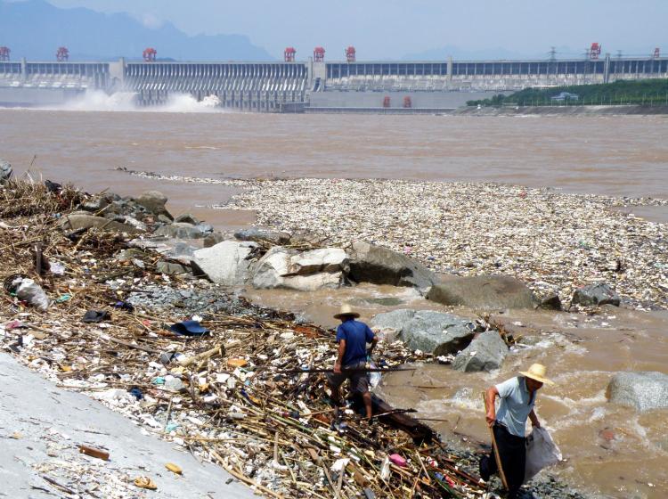 Workers clean up along the banks of the Yangtze River near the Three Gorges Dam in Yichang, in central China's Hubei province on August 1, 2010. (AFP/Getty Images) Workers clean up along the banks of the Yangtze River near the Three Gorges Dam in Yichang, in central China's Hubei province on August 1, 2010. (AFP/Getty Images)