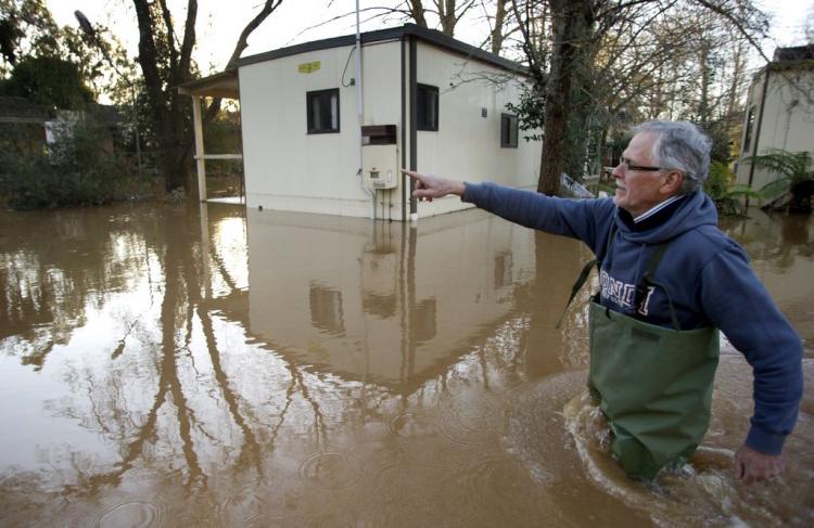 Local Geoffrey Scott inspects his flooded caravan park as floods hit the northern Victorian town of Myrtleford, some 250 kms northeast of Melbourne, on September 6, 2010. (William West/AFP/Getty Images) Local Geoffrey Scott inspects his flooded caravan park as floods hit the northern Victorian town of Myrtleford, some 250 kms northeast of Melbourne, on September 6, 2010. (William West/AFP/Getty Images)