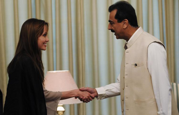 US actress and UNHCR Goodwill Ambassador Angelina Jolie shakes hands with Pakistani Prime Minister Yousaf Raza Gillani in Islamabad on September 8. Jolie visited Pakistan's northwest September 7 to draw the world's attention towards the plight of 21 million people affected by the country's worst-ever floods. (Farooq Naeem/Getty Images) US actress and UNHCR Goodwill Ambassador Angelina Jolie shakes hands with Pakistani Prime Minister Yousaf Raza Gillani in Islamabad on September 8. Jolie visited Pakistan's northwest September 7 to draw the world's attention towards the plight of 21 million people affected by the country's worst-ever floods. (Farooq Naeem/Getty Images)