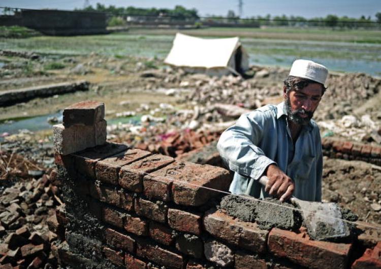 A Pakistani man begins to rebuild his home in Nowshera on September 21. United Nation aid agencies have warned that flood stricken areas of Pakistan face a looming threat of child malnutrition. (Carl de Souza/Getty Images ) A Pakistani man begins to rebuild his home in Nowshera on September 21. United Nation aid agencies have warned that flood stricken areas of Pakistan face a looming threat of child malnutrition. (Carl de Souza/Getty Images )