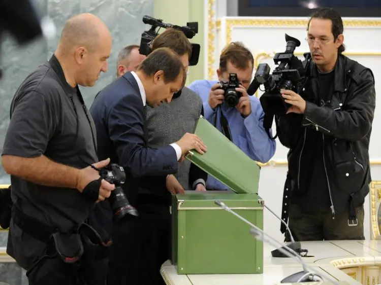 Journalists take photos of declassified files on the Katyn massacre that were handed over to Polish diplomats during a ceremony at the Russian prosecutor general's office in Moscow on Sept. 23. (Alexander Nemenov/AFP/Getty Images)