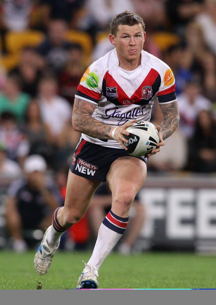 Todd Carney of the Roosters runs with the ball during the First NRL Preliminary Final match between the Gold Coast Titans and the Sydney Roosters at Suncorp Stadium on Sept. 24 in Brisbane. (Bradley Kanaris/Getty Images) Todd Carney of the Roosters runs with the ball during the First NRL Preliminary Final match between the Gold Coast Titans and the Sydney Roosters at Suncorp Stadium on Sept. 24 in Brisbane. (Bradley Kanaris/Getty Images)