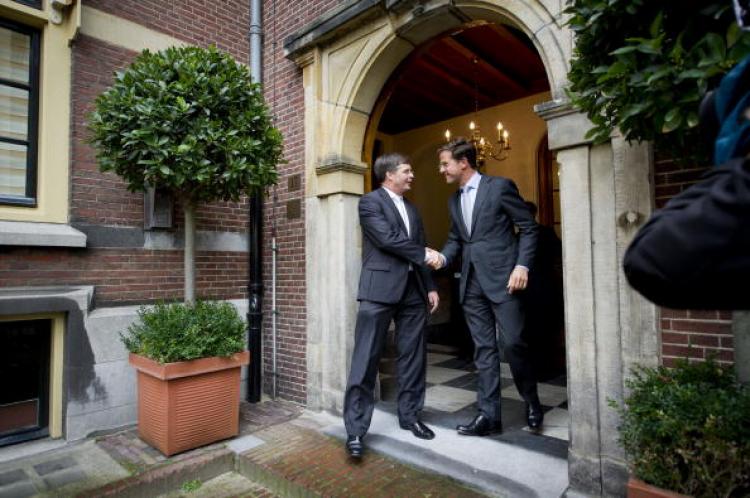 Prime Minister Mark Rutte says farewell to his predecessor Jan Peter Balkenende (L) on Oct. 14, 2010, at the doorstep of the prime ministers' office in The Hague. (Valerie Kuypers/AFP/Getty Images) Prime Minister Mark Rutte says farewell to his predecessor Jan Peter Balkenende (L) on Oct. 14, 2010, at the doorstep of the prime ministers' office in The Hague. (Valerie Kuypers/AFP/Getty Images)