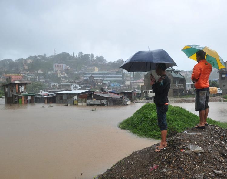Residents looking over their homes submerged by flooding due to Typhoon Megi north of Manila on October 19. Heavy rains once again continue to cause major flooding and landslides in the Philippines. (Ted Aljibe/Getty Images) Residents looking over their homes submerged by flooding due to Typhoon Megi north of Manila on October 19. Heavy rains once again continue to cause major flooding and landslides in the Philippines. (Ted Aljibe/Getty Images)