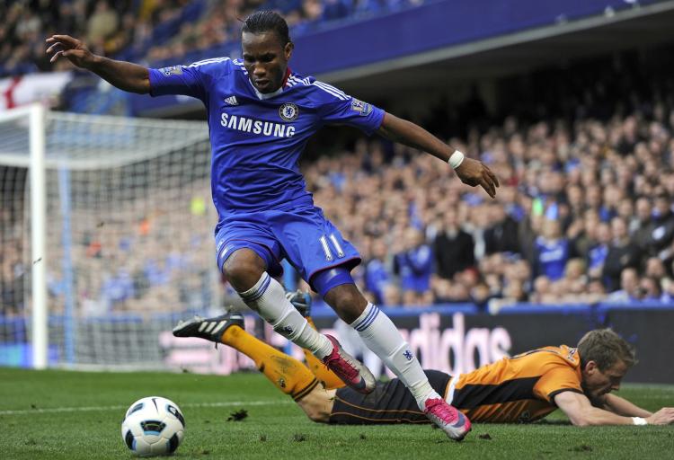 Chelsea's Ivorian striker Didier Drogba (L) vies with Wolverhampton Wanderers Scottish defender Christophe Berra (R) at Stamford Bridge in London on Saturday. (Glyn Kirk/AFP/Getty Images) Chelsea's Ivorian striker Didier Drogba (L) vies with Wolverhampton Wanderers Scottish defender Christophe Berra (R) at Stamford Bridge in London on Saturday. (Glyn Kirk/AFP/Getty Images)
