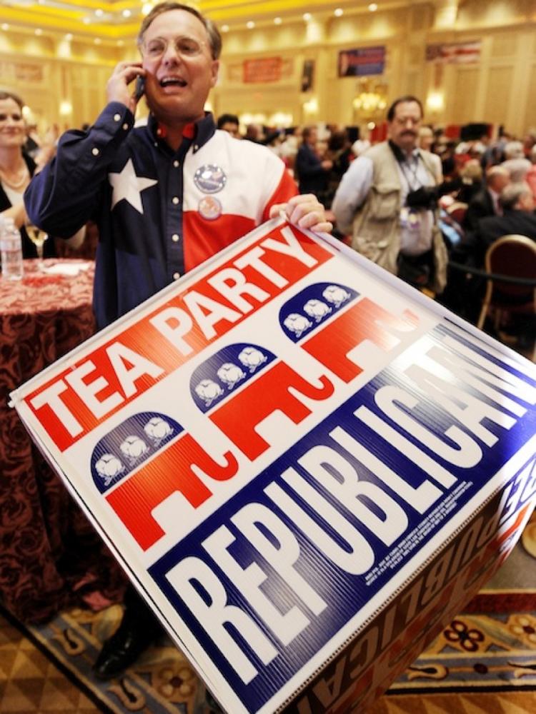 TEA PARTY MOVEMENT: A Tea Party supporter holds a sign on Nov. 2, at the Nevada Republican Party's Election Night event in Las Vegas, NV. (Robyn Beck/AFP/Getty Images) TEA PARTY MOVEMENT: A Tea Party supporter holds a sign on Nov. 2, at the Nevada Republican Party's Election Night event in Las Vegas, NV. (Robyn Beck/AFP/Getty Images)