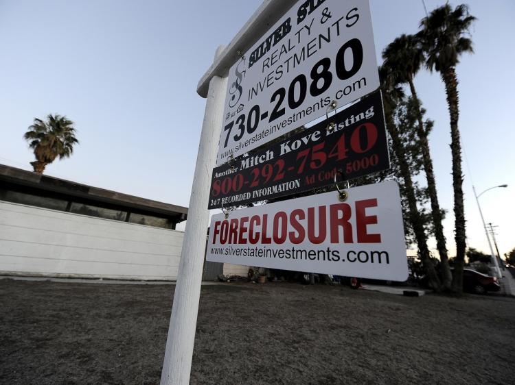 NO 'ROBO-SIGNING': A Foreclosure sign is seen in front of a bank-owned home in Las Vegas, Nev., Nov. 8. All 50 states have unveiled a joint investigation into banks and mortgage companies that repossessed homes in the wake of the financial crisis. (Robyn Beck/AFP/Getty Images) NO 'ROBO-SIGNING': A Foreclosure sign is seen in front of a bank-owned home in Las Vegas, Nev., Nov. 8. All 50 states have unveiled a joint investigation into banks and mortgage companies that repossessed homes in the wake of the financial crisis. (Robyn Beck/AFP/Getty Images)