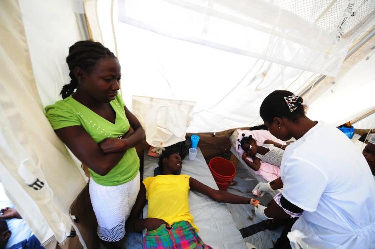 Haitians stricken with cholera are seen at a hospital in the Cite Soleil slum of Port-au-Prince on November 10. (A Thony Belizaire/Getty Images) Haitians stricken with cholera are seen at a hospital in the Cite Soleil slum of Port-au-Prince on November 10. (A Thony Belizaire/Getty Images)