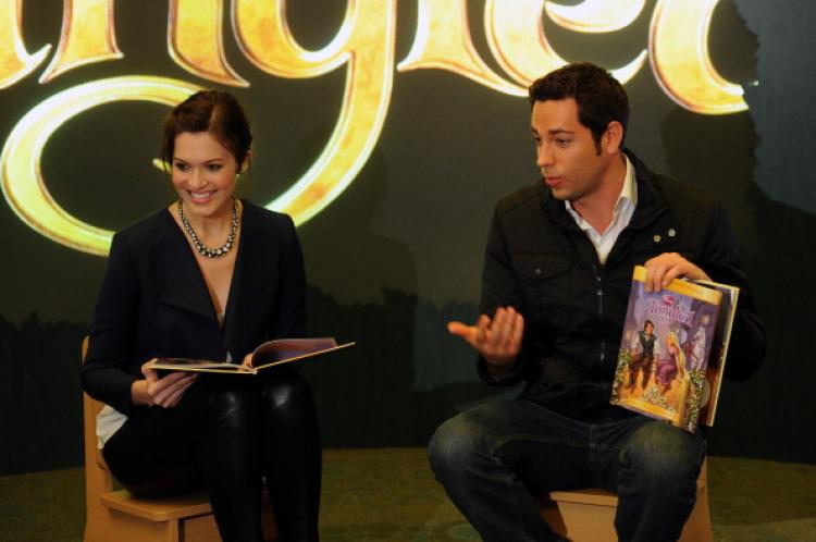 Mandy Moore and Zach Levi read to children to promote their new movie 'Tangled' at the Disney Store on Nov. 19, in New York City. (Bryan Bedder/Getty Images) Mandy Moore and Zach Levi read to children to promote their new movie 'Tangled' at the Disney Store on Nov. 19, in New York City. (Bryan Bedder/Getty Images)