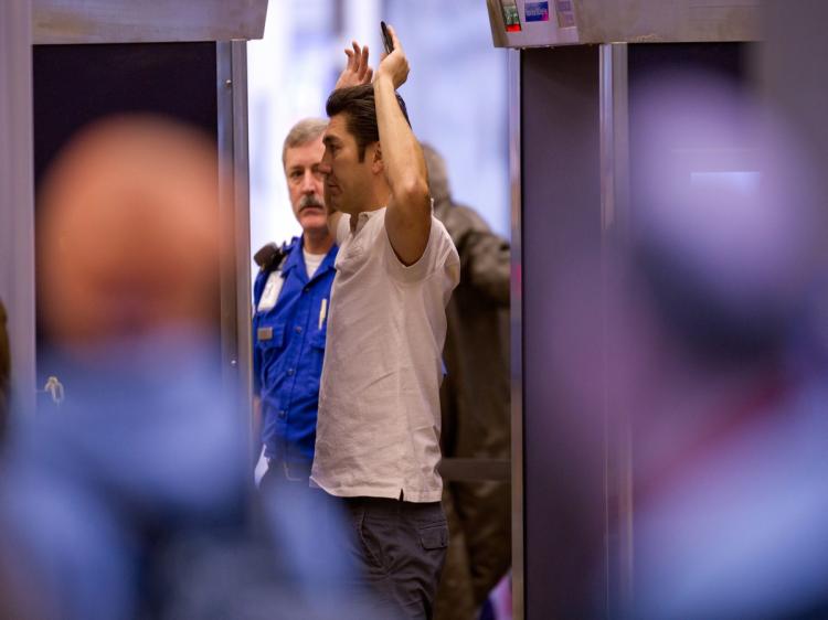 A male traveler submits to a full body scan before heading to his flight at Pittsburgh International Airport November 24, 2010. (Jeff Swensen/Getty Images) A male traveler submits to a full body scan before heading to his flight at Pittsburgh International Airport November 24, 2010. (Jeff Swensen/Getty Images)