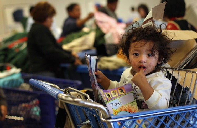 A child waits as his mother joins fellow low-income shoppers searching bins for toys at a Goodwill thrift store on Black Friday, November 26, 2010 in Denver, Colorado. (John Moore/Getty Images) A child waits as his mother joins fellow low-income shoppers searching bins for toys at a Goodwill thrift store on Black Friday, November 26, 2010 in Denver, Colorado. (John Moore/Getty Images)