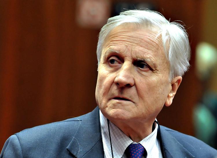 WORRIED: European Central Bank president Jean-Claude Trichet looks on at the ECOFIN Council meeting on Nov. 28 at the EU headquarters in Brussels. Economists fear that Ireland's recent financial woes may spread to other regional economies such as Italy and Spain. (Georges Gobet/AFP/Getty Images)