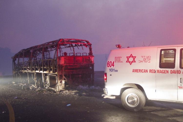 A charred bus that was carrying prison guards on Dec. 2, 2010, near Israel's northern city of Haifa. (Jack Guez/AFP/Getty Images) A charred bus that was carrying prison guards on Dec. 2, 2010, near Israel's northern city of Haifa. (Jack Guez/AFP/Getty Images)