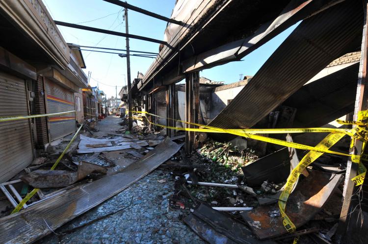 A general view shows damage caused to buildings on South Korea's Yeonpyeong Island, on Dec. 3, following a North Korean artillery and rocket attack. The International Criminal Court, based in The Hague, is investigating whether North Korea is guilty of war crimes. (Kim Jae-Hwan/Getty Images ) A general view shows damage caused to buildings on South Korea's Yeonpyeong Island, on Dec. 3, following a North Korean artillery and rocket attack. The International Criminal Court, based in The Hague, is investigating whether North Korea is guilty of war crimes. (Kim Jae-Hwan/Getty Images )