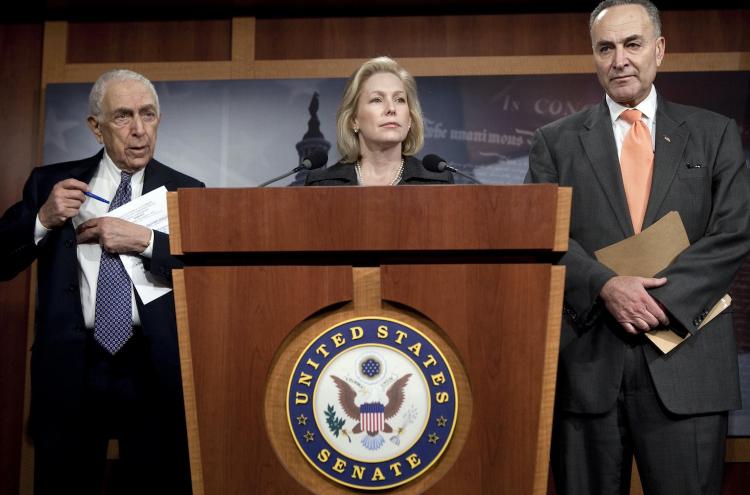 Sen. Frank Lautenberg (D-NJ) (L) and Sen. Kirsten Gillibrand (D-NY) (R) listen as Sen. Charles Schumer (D-NY) speaks about the 9/11 health bill during a press conference on Capitol Hill in Washington on Dec. 9. (Brendan Smialowski/Getty Images) Sen. Frank Lautenberg (D-NJ) (L) and Sen. Kirsten Gillibrand (D-NY) (R) listen as Sen. Charles Schumer (D-NY) speaks about the 9/11 health bill during a press conference on Capitol Hill in Washington on Dec. 9. (Brendan Smialowski/Getty Images)