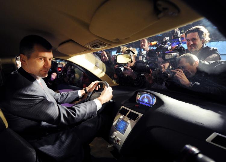 One of the richest men of Russia, Mikhail Prokhorov, sits on December 13, 2010 in a Sport Coupe variant of the E-mobile hybrid cars during the vehicle's presentation in Moscow. (Natalia Kolesnikova/AFP/Getty Images) One of the richest men of Russia, Mikhail Prokhorov, sits on December 13, 2010 in a Sport Coupe variant of the E-mobile hybrid cars during the vehicle's presentation in Moscow. (Natalia Kolesnikova/AFP/Getty Images)