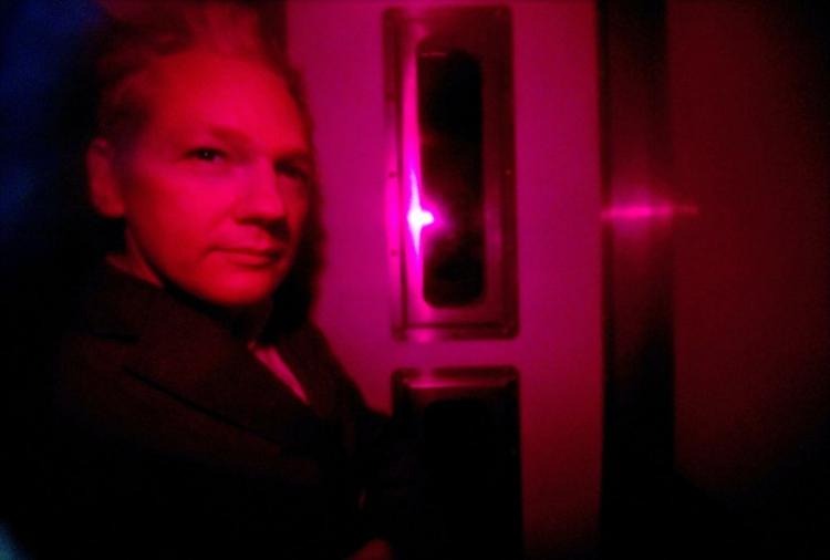 Julian Assange, WikiLeaks founder, is pictured through the heavily tinted windows of a police vehicle as he arrives at Westminster magistrates court in London on Dec. 14. (Carl Court/AFP/Getty Images) Julian Assange, WikiLeaks founder, is pictured through the heavily tinted windows of a police vehicle as he arrives at Westminster magistrates court in London on Dec. 14. (Carl Court/AFP/Getty Images)