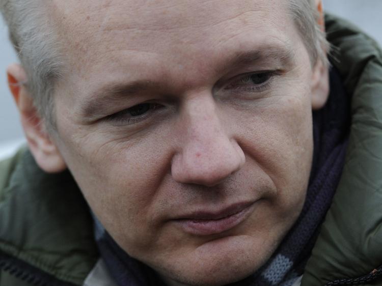 Julian Assange, WikiLeaks founder, speaks with journalists at Diss train station in Norfolk on Dec. 18. (Carl Court/AFP/Getty Images) Julian Assange, WikiLeaks founder, speaks with journalists at Diss train station in Norfolk on Dec. 18. (Carl Court/AFP/Getty Images)