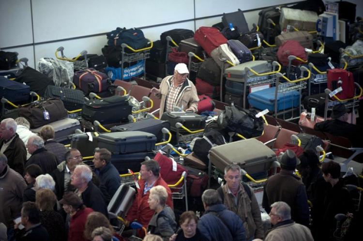A man looks for his luggage at the Charles de Gaulle-Roissy airport, in Roissy-en-France, outside Paris. (Bertrand Langlois/AFP/Getty Images) A man looks for his luggage at the Charles de Gaulle-Roissy airport, in Roissy-en-France, outside Paris. (Bertrand Langlois/AFP/Getty Images)