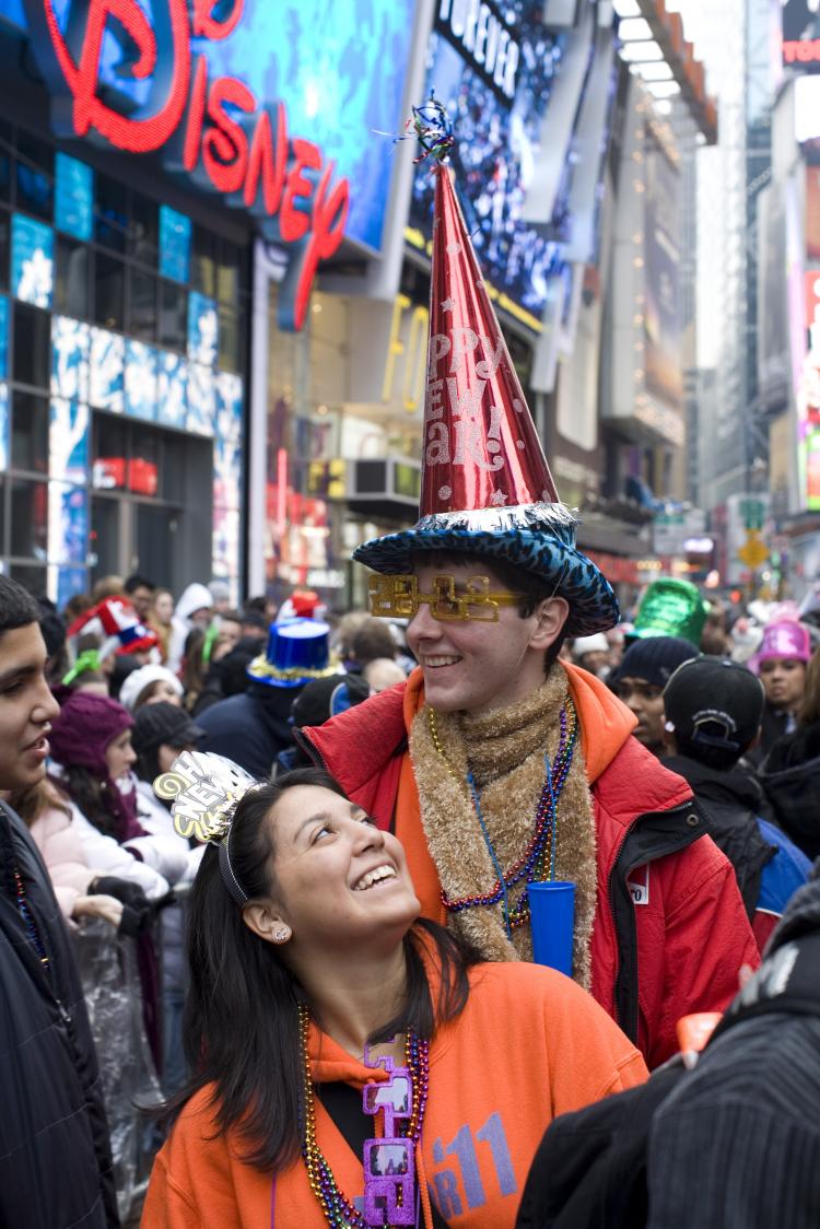 New Year's Eve in Times Square: Revelers who want a good view of the ball dropping arrive early in the afternoon and wait until midnight. (Brian Harkin/Getty Images) New Year's Eve in Times Square: Revelers who want a good view of the ball dropping arrive early in the afternoon and wait until midnight. (Brian Harkin/Getty Images)