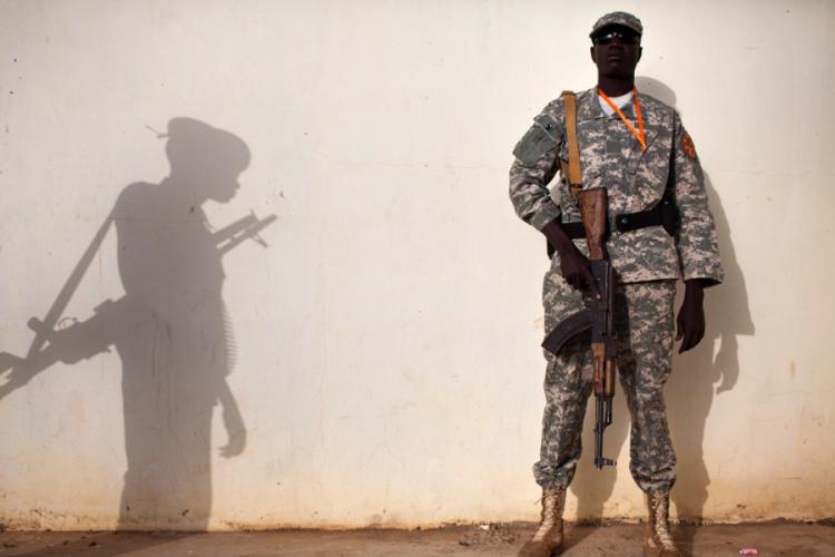 Two members of the Sudanese Liberation Movement stand guard. (Yasuyoshi Chiba/AFP/Getty Images) Two members of the Sudanese Liberation Movement stand guard. (Yasuyoshi Chiba/AFP/Getty Images)