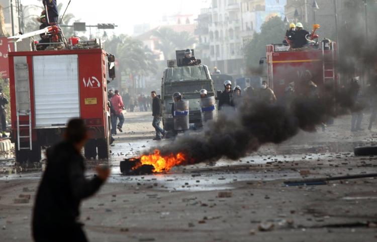 A burning tire and rocks litter the streets as Egyptians protesters clash with anti-riot police on the streets of Suez, northern Egypt, on January 27 2011, demanding the ouster of President Hosni Mubarak. (Khaled Desouki/AFP/Getty Images) A burning tire and rocks litter the streets as Egyptians protesters clash with anti-riot police on the streets of Suez, northern Egypt, on January 27 2011, demanding the ouster of President Hosni Mubarak. (Khaled Desouki/AFP/Getty Images)