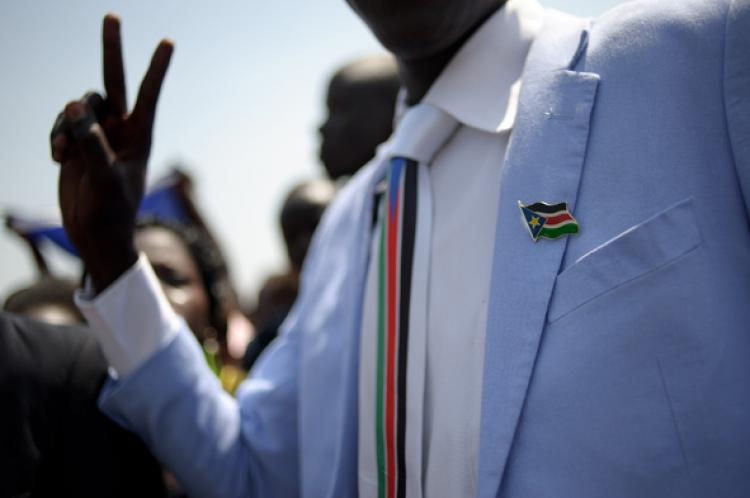 A man dressed in Southern Sudan style clothing wearing a pin and tie celebrating the announcement of the preliminary results of the Southern Sudan independence referendum in Juba on January 30, 2011. South Sudan voted overwhelmingly for independence from the north, with close to 99% in favor of secession. (Phil Moore/Getty Images ) A man dressed in Southern Sudan style clothing wearing a pin and tie celebrating the announcement of the preliminary results of the Southern Sudan independence referendum in Juba on January 30, 2011. South Sudan voted overwhelmingly for independence from the north, with close to 99% in favor of secession. (Phil Moore/Getty Images )