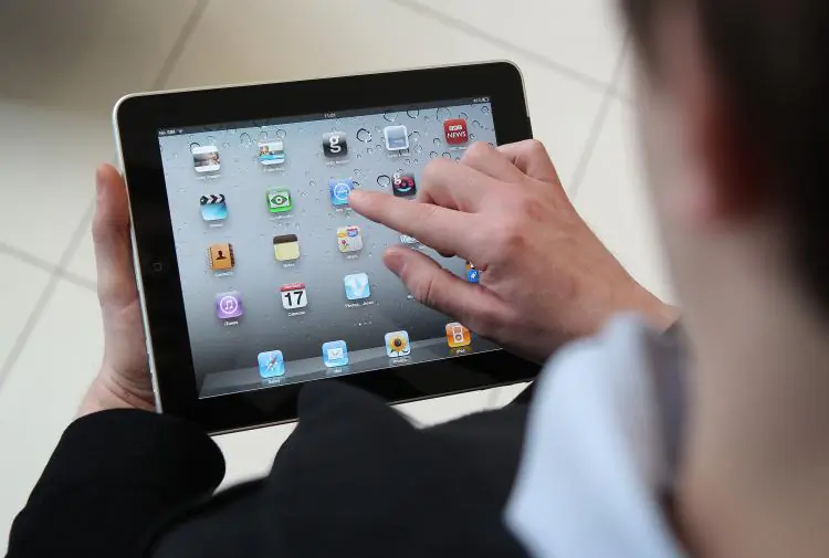 A man uses an Apple iPad tablet. (Peter Macdiarmid/Getty Images)