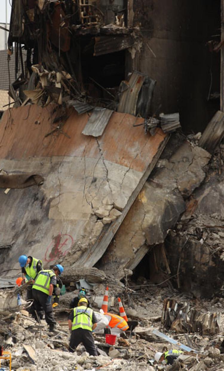 Search and rescue teams scour through the wreckage of the CTV building on February 28, in Christchurch, New Zealand. The death toll from the earthquake has risen to 148 and the hope for finding survivors is fading as rescuers search through debris for over 200 still missing. ( Phil Walter/Getty Images) Search and rescue teams scour through the wreckage of the CTV building on February 28, in Christchurch, New Zealand. The death toll from the earthquake has risen to 148 and the hope for finding survivors is fading as rescuers search through debris for over 200 still missing. ( Phil Walter/Getty Images)