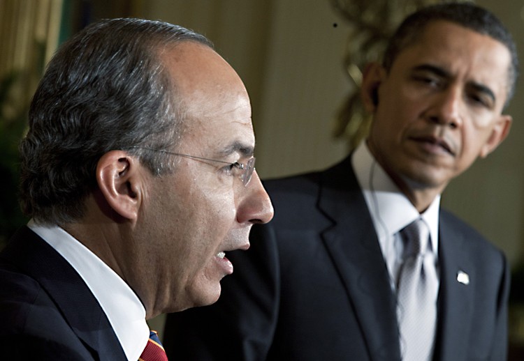 TARIFFS LIFTED: President Barack Obama (R) listens while Mexican President Felipe Calderon speaks during a joint news conference in the East Room of the White House. (Brendan Smialowski/Getty Images)