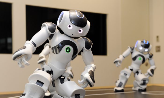 Humanoid robots called 'Nao' from the French robotics venture Aldebaran demonstrate their skills during a display at the French Embassy in Tokyo on October 13, 2010. (YOSHIKAZU TSUNO/AFP/Getty Images)