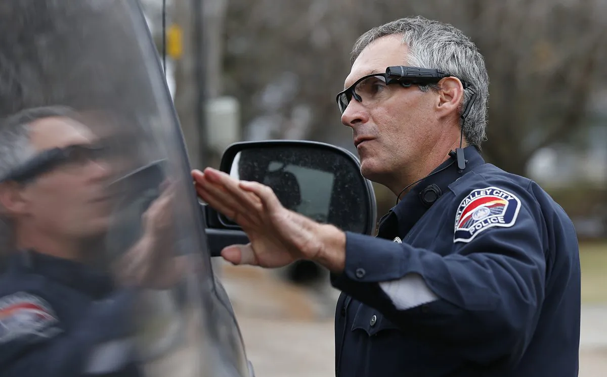 West Valley City patrol officer Gatrell performs a traffic stop on the first day of use of his newly-issued body camera attached to the side of a pair of glasses on March 2, 2015 in West Valley City, Utah. (George Frey/Getty Images)