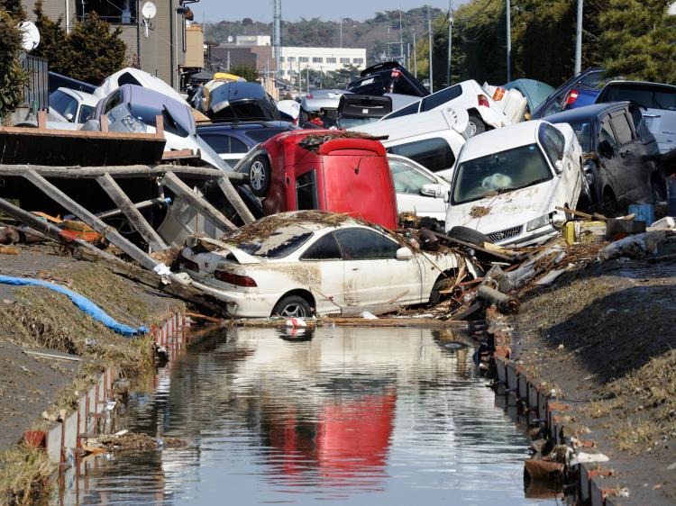 Vehicles block a canal after they were deposited there in Tagajo, Miyagi prefecture on March 13, 2011 following a massive earthquake and tsunami on March 11. (Toru Yamanaka/AFP/Getty Images) Vehicles block a canal after they were deposited there in Tagajo, Miyagi prefecture on March 13, 2011 following a massive earthquake and tsunami on March 11. (Toru Yamanaka/AFP/Getty Images)