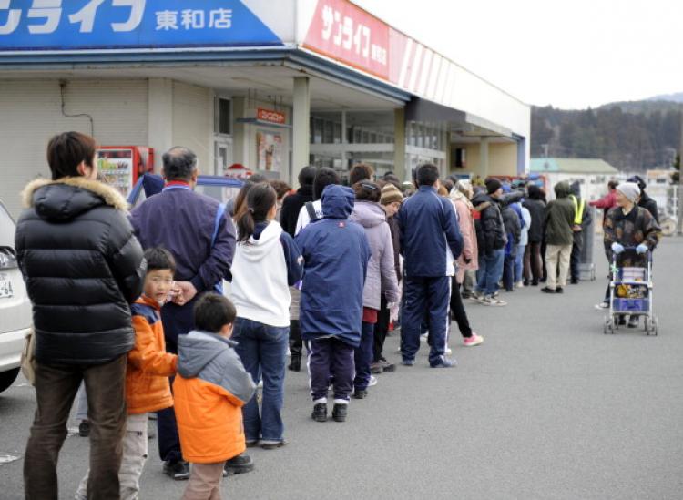 Customers queue up outside a supermarket to buy food, in the city of Hanamaki in Iwate prefecture on March 15, as the country struggles to cope following the March 11 earthquake and tsunami disasters. (Toshifumi Kitamura/AFP/Getty Images)