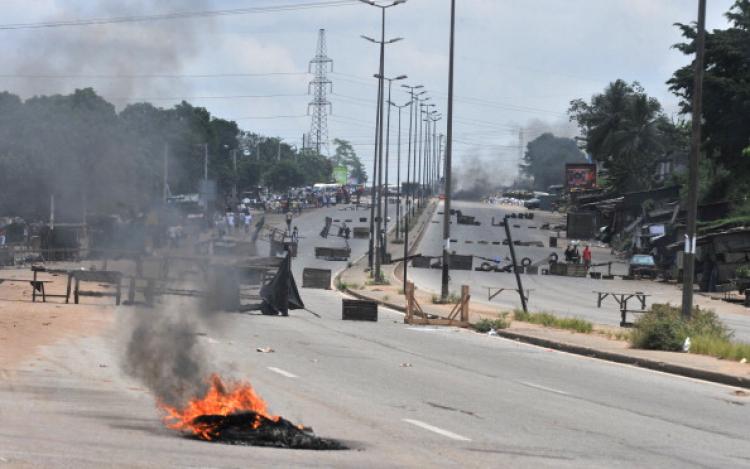 A picture of barricades and burning tires on the main road leading to the Abobo district of Abidjan taken on March 15, 2011. (Issouf Sanogo/AFP/Getty Images) A picture of barricades and burning tires on the main road leading to the Abobo district of Abidjan taken on March 15, 2011. (Issouf Sanogo/AFP/Getty Images)