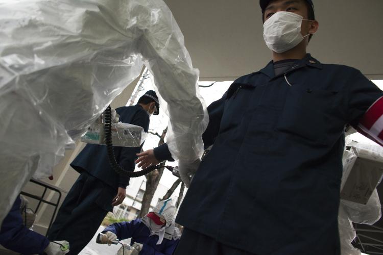 A Japanese policeman undergoes testing for possible nuclear radiation at screening center about (22 miles) 35 kilometers away from Fukushima Nuclear Power Plant on April 9 in Fukushima prefecture. (Athit Perawongmetha/Getty Images) A Japanese policeman undergoes testing for possible nuclear radiation at screening center about (22 miles) 35 kilometers away from Fukushima Nuclear Power Plant on April 9 in Fukushima prefecture. (Athit Perawongmetha/Getty Images)