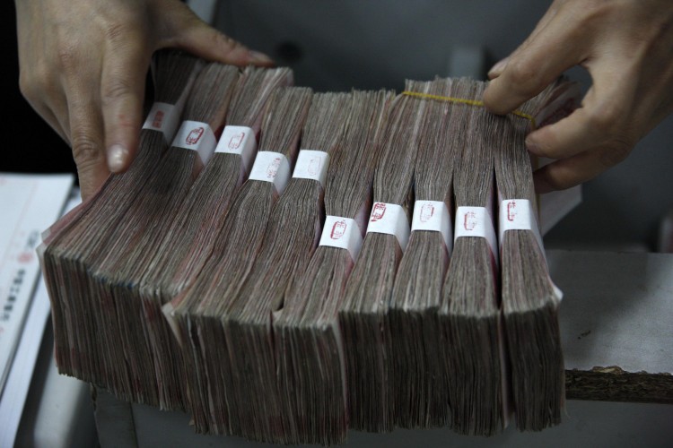 Stacks of Chinese Yuan will now be kept in reserve. (ChinaFotoPress/Getty Images) Stacks of Chinese Yuan will now be kept in reserve. (ChinaFotoPress/Getty Images)