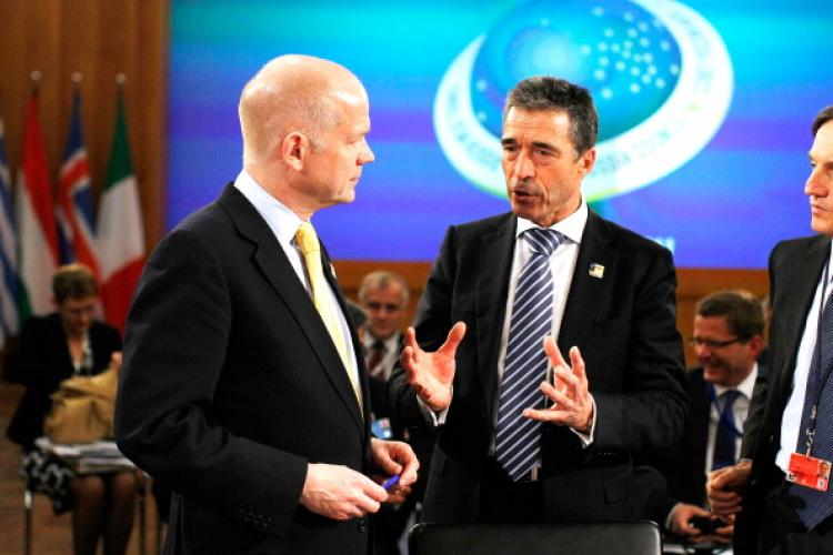 NATO Secretary General Anders Fogh Rasmussen (R) talks with U.K. Foreign Secretary William Hague (L) at an informal meeting of NATO member foreign ministers on April 15, 2011 in Berlin, Germany. (Carsten Koall/Getty Images) NATO Secretary General Anders Fogh Rasmussen (R) talks with U.K. Foreign Secretary William Hague (L) at an informal meeting of NATO member foreign ministers on April 15, 2011 in Berlin, Germany. (Carsten Koall/Getty Images)