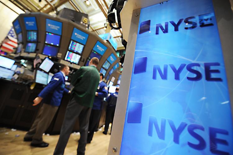 STOCKS JUMP: Workers are seen on the floor of the New York Stock Exchange Wednesday April 20. U.S. markets gained across the board as corporate earnings propelled stocks higher. (Stan Honda/AFP/Getty Images) STOCKS JUMP: Workers are seen on the floor of the New York Stock Exchange Wednesday April 20. U.S. markets gained across the board as corporate earnings propelled stocks higher. (Stan Honda/AFP/Getty Images)