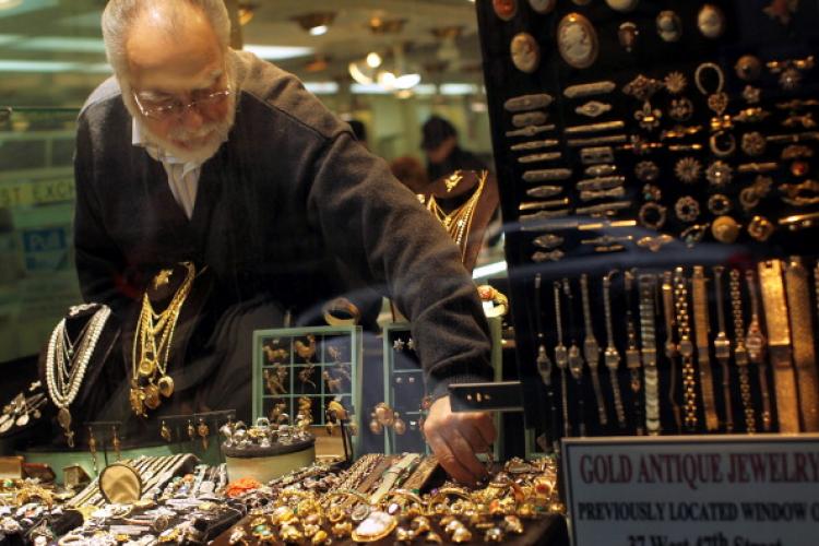 A gold jeweler reaches for a display piece in the window on April 19, 2011 in New York City. Gold futures climbed to a record $1,500 level today following a weaker dollar and higher oil prices. Gold settled at a record $1,494.50 per troy ounce on the Come (Spencer Platt/Getty Images) A gold jeweler reaches for a display piece in the window on April 19, 2011 in New York City. Gold futures climbed to a record $1,500 level today following a weaker dollar and higher oil prices. Gold settled at a record $1,494.50 per troy ounce on the Come (Spencer Platt/Getty Images)