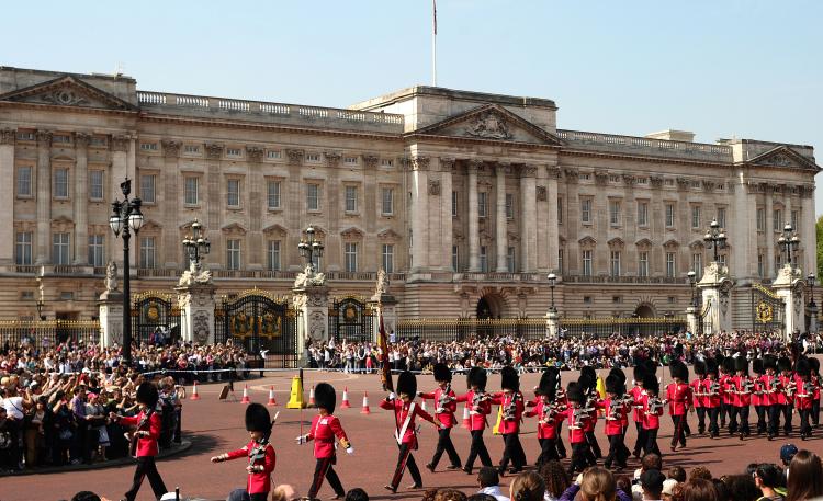 Tourists watch the daily ceremony of the Changing of the Guard outside Buckingham Palace on April 22. Fountains have been cleaned, lawns trimmed, and giant Union Jack flags are flying as London puts on its best face for Prince William and Kate Middleton's wedding on April 29. Hundreds of thousands of well-wishers are expected in addition to the hundreds of VIPs invited to attend the ceremony at Westminster Abbey. (Carl De Souza/AFP/Getty Images) Tourists watch the daily ceremony of the Changing of the Guard outside Buckingham Palace on April 22. Fountains have been cleaned, lawns trimmed, and giant Union Jack flags are flying as London puts on its best face for Prince William and Kate Middleton's wedding on April 29. Hundreds of thousands of well-wishers are expected in addition to the hundreds of VIPs invited to attend the ceremony at Westminster Abbey. (Carl De Souza/AFP/Getty Images)