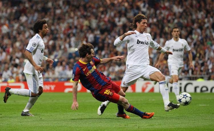 Lionel Messi of Barcelona scores his second goal during the UEFA Champions League semifinal first leg match between Real Madrid and Barcelona at Estadio Santiago Bernabeu on Wednesday. (Alex Livesey/Getty Images) Lionel Messi of Barcelona scores his second goal during the UEFA Champions League semifinal first leg match between Real Madrid and Barcelona at Estadio Santiago Bernabeu on Wednesday. (Alex Livesey/Getty Images)