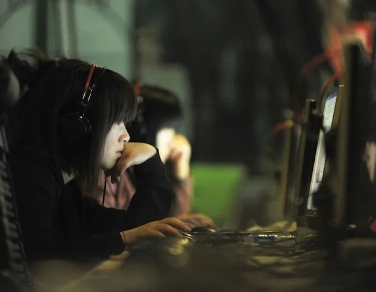 People at an internet cafe in Beijing, China on May 12, 2015. Hackers from China reportedly have compromised the computer network of the Australian National University (ANU).  (Gou Yige/Getty Images)