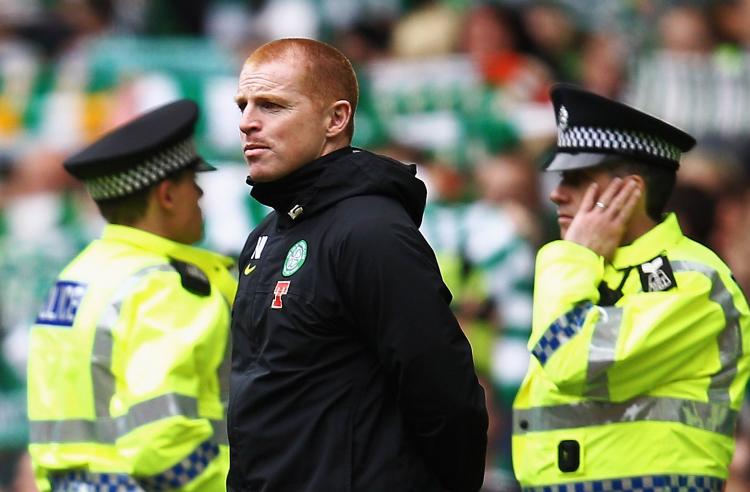 Manager Neil Lennon of Celtic, flanked by police officers, looks on as the crowd sing 'You'll never walk alone' at the end of the Clydesdale Bank Premier League match between Celtic and Motherwell at Celtic Park on May 15, 2011 in Glasgow, Scotland. ( Paul Gilham/Getty Images) Manager Neil Lennon of Celtic, flanked by police officers, looks on as the crowd sing 'You'll never walk alone' at the end of the Clydesdale Bank Premier League match between Celtic and Motherwell at Celtic Park on May 15, 2011 in Glasgow, Scotland. ( Paul Gilham/Getty Images)