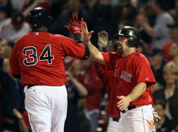 Kevin Youkilis #20 and David Ortiz #34 of the Boston Red Sox celebrate after they scored against the Chicago Cubs on May 20, 2011 at Fenway Park in Boston, Massachusetts (Elsa/Getty Images) Kevin Youkilis #20 and David Ortiz #34 of the Boston Red Sox celebrate after they scored against the Chicago Cubs on May 20, 2011 at Fenway Park in Boston, Massachusetts (Elsa/Getty Images)