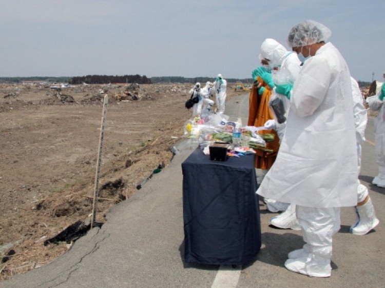 Residents, who lived within a 20km area of a stricken nuclear power plant, offer prayers for victims of the March 11 earthquake and tsunami, in the Fukushima prefecture on May 26. (Jiji Press/AFP/Getty Images)