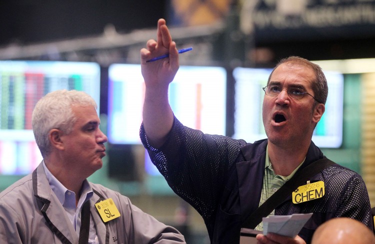 Traders work in the crude oil options pit during afternoon trading at the New York Mercantile Exchange, June 8 in New York City in this file photo. (Mario Tama/Getty Images)